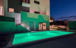 Villa Salt pool at night in green