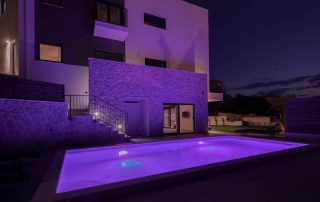 Villa Salt pool at night in violet